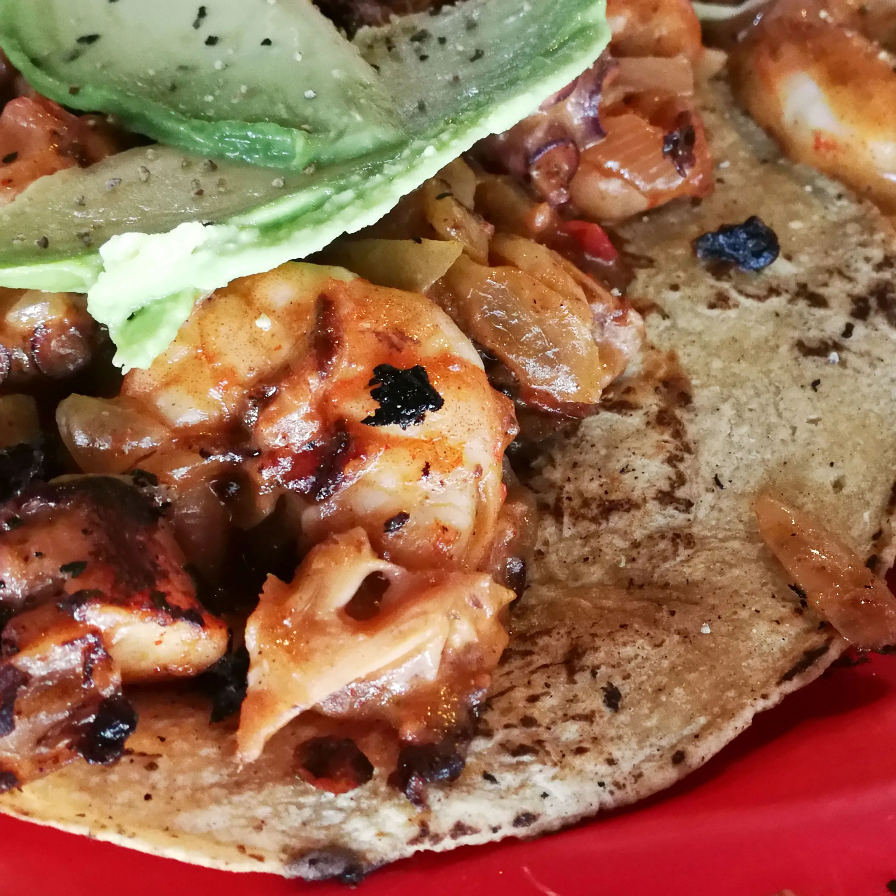 Peladito’s shrimp taco is shrimp, grilled in a hot salsa, with avocado and lime on a hot corn tortilla is simply a truly heavenly combination.