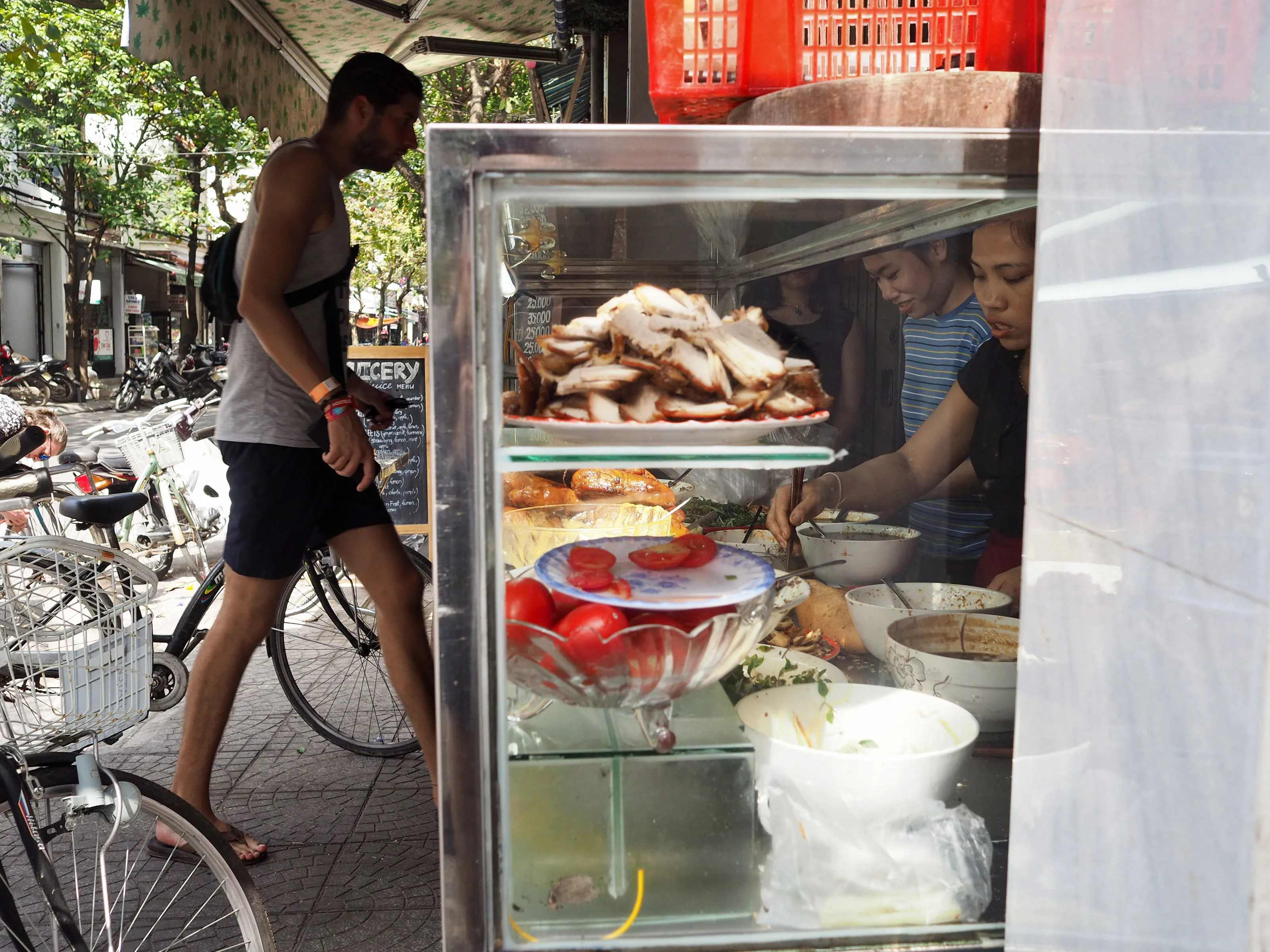 The chefs at banh mi khanh prepare sandwiches for an endless stream of customers